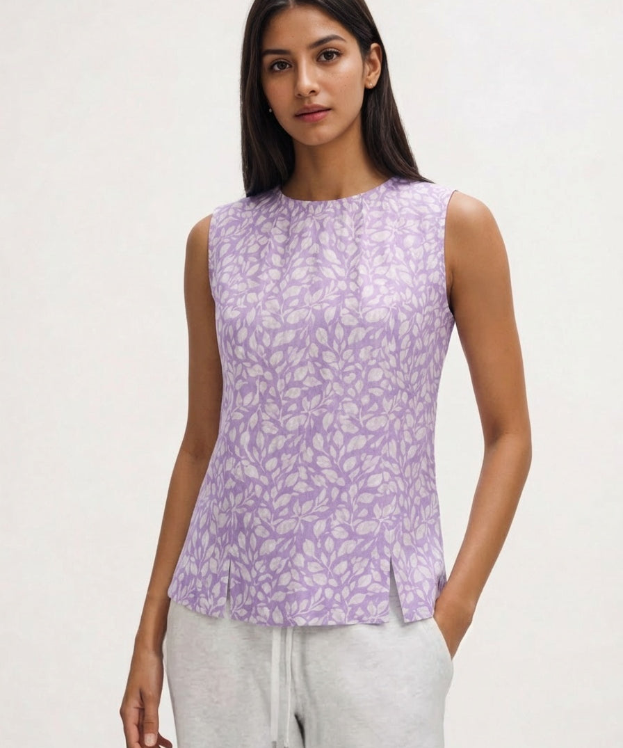 Woman wearing a purple sleeveless top with a white background