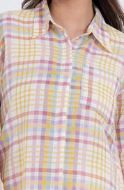 Close-up of multicolor plaid checkered design on a button-up shirt.