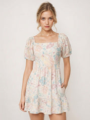 Woman wearing a floral dress with puff sleeves