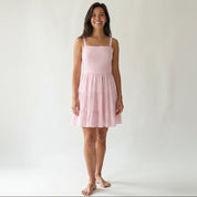 Pink cotton mini dress with vertical stripes and tiered ruffle skirt