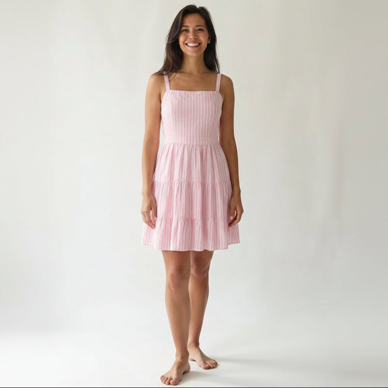 Pink cotton mini dress with vertical stripes and tiered ruffle skirt