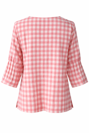Pink and white checkered blouse on a white background