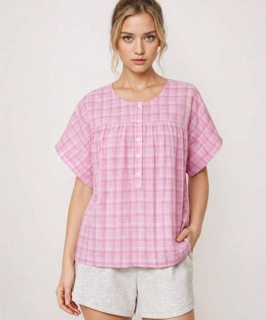 Woman wearing a pink checkered top