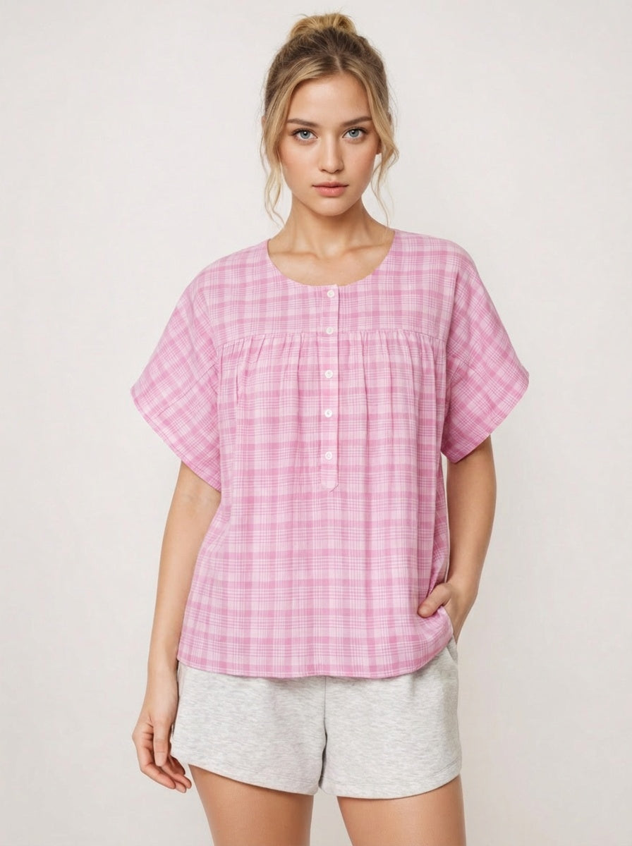 Woman wearing a pink checkered top