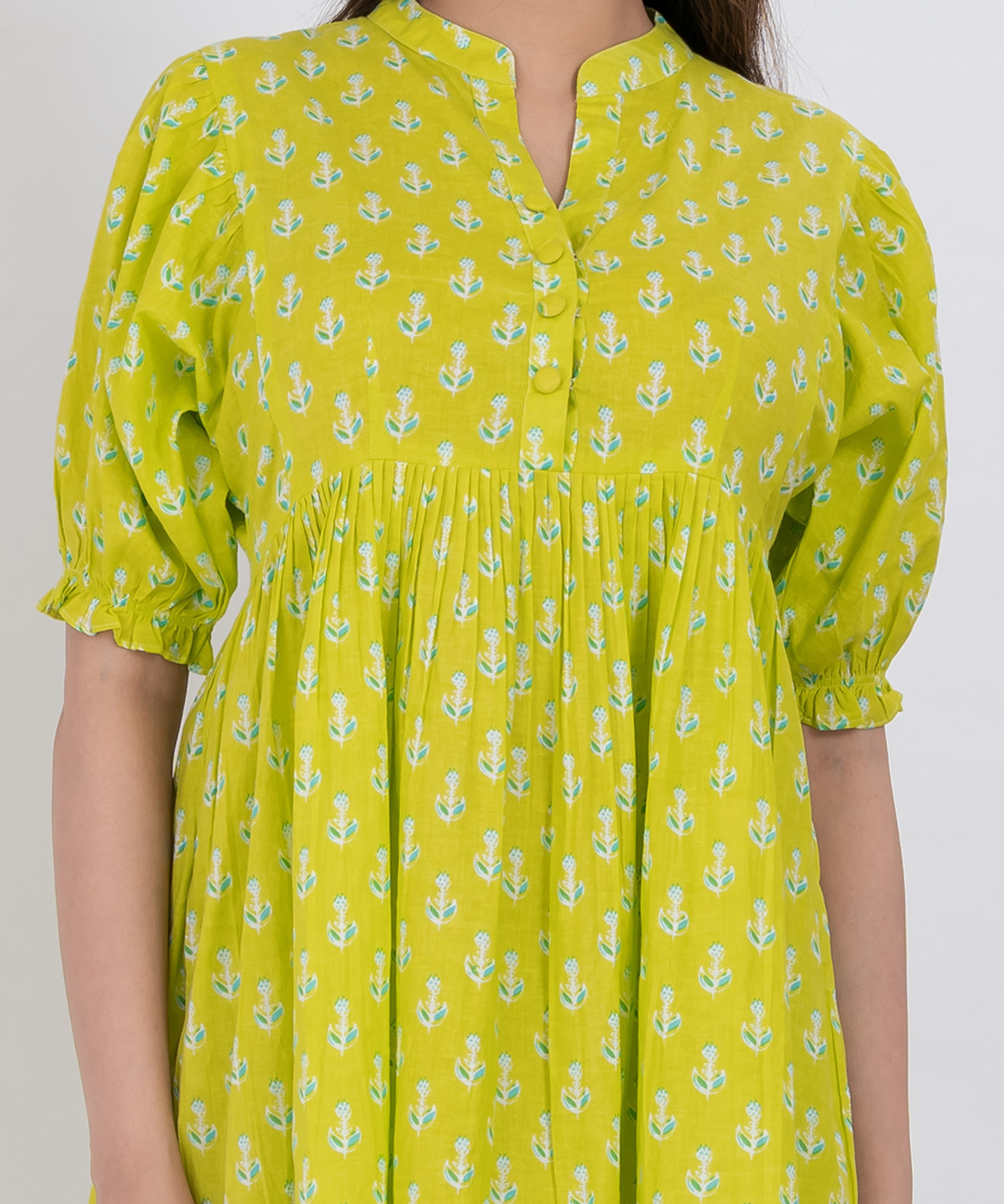  Close-up of floral printed cotton fabric and puff sleeve details