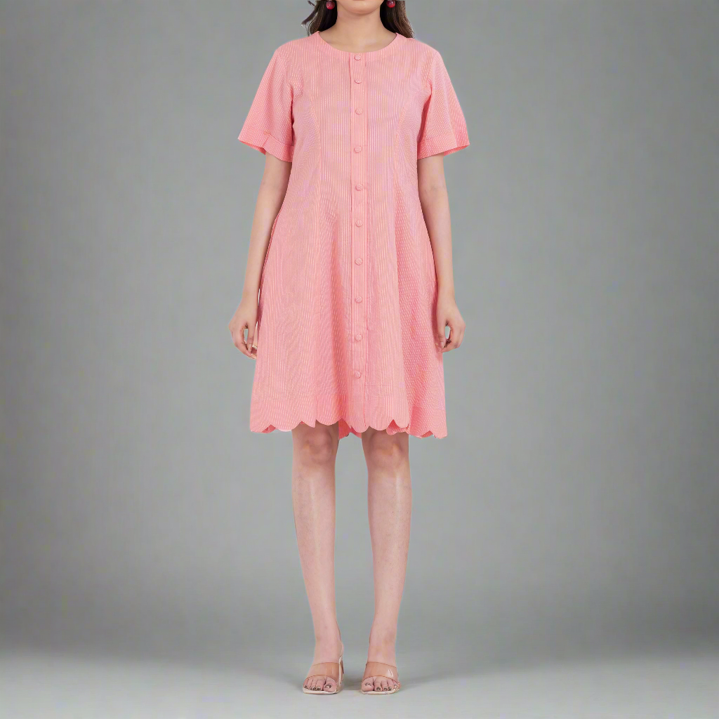 Short sleeve cotton dress with a button-up front and scalloped hemline for added charm