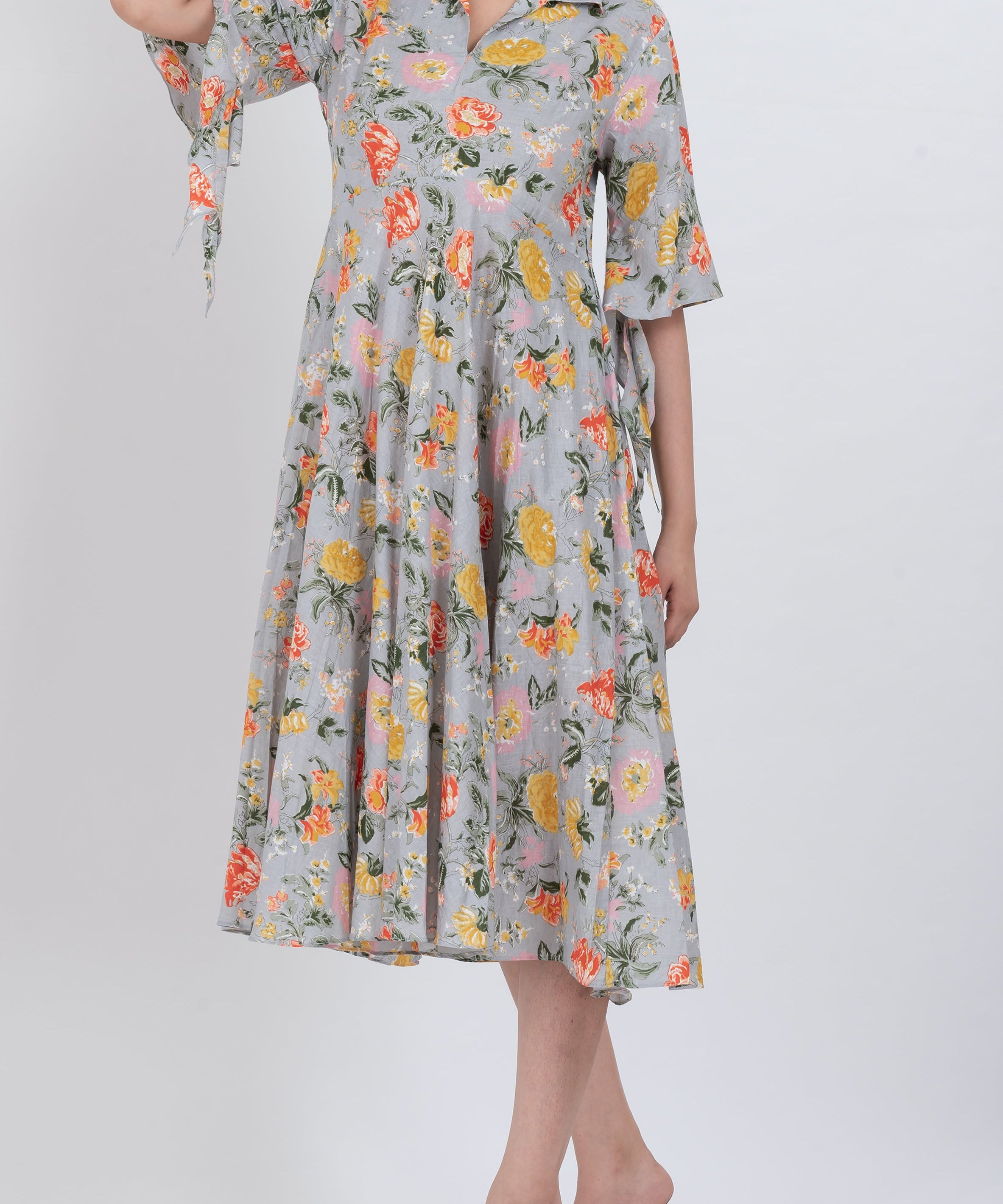 Floral V-neck dress with kimono sleeves and button front detail