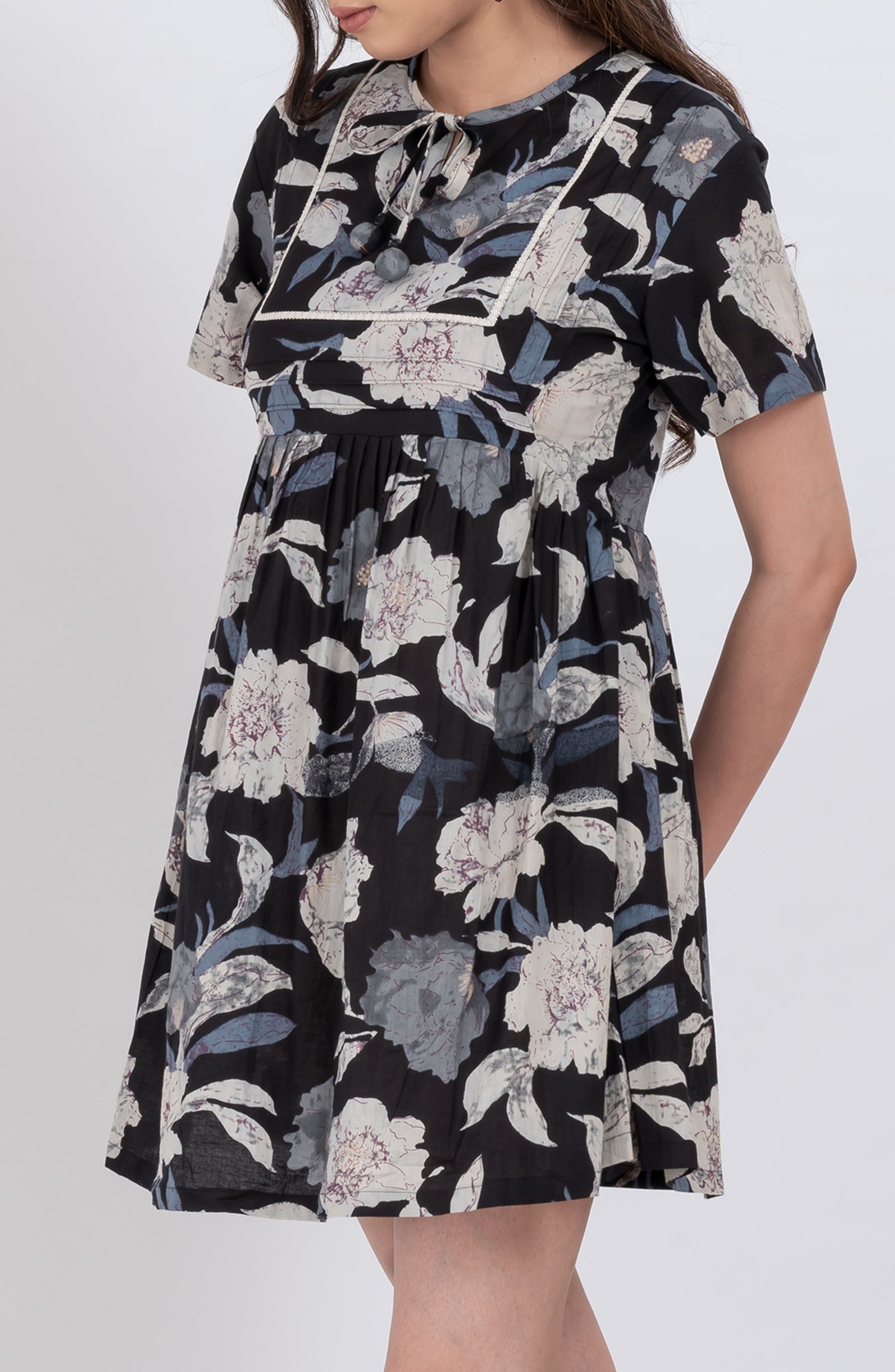 Flowy floral tie neck babydoll dress with feminine design