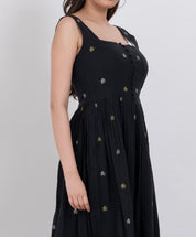 Sleeveless floral handwoven cotton dress with square neckline and button front.