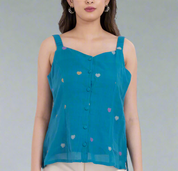 Sleeveless blouse with embroidered heart details.