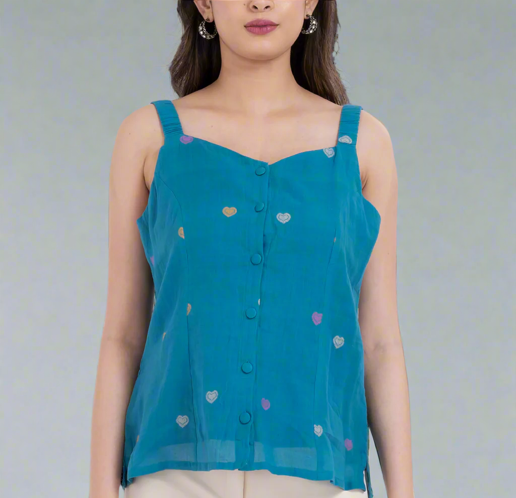 Sleeveless blouse with embroidered heart details.
