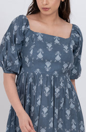 Flattering floral puff sleeve dress with square neck and flowy skirt