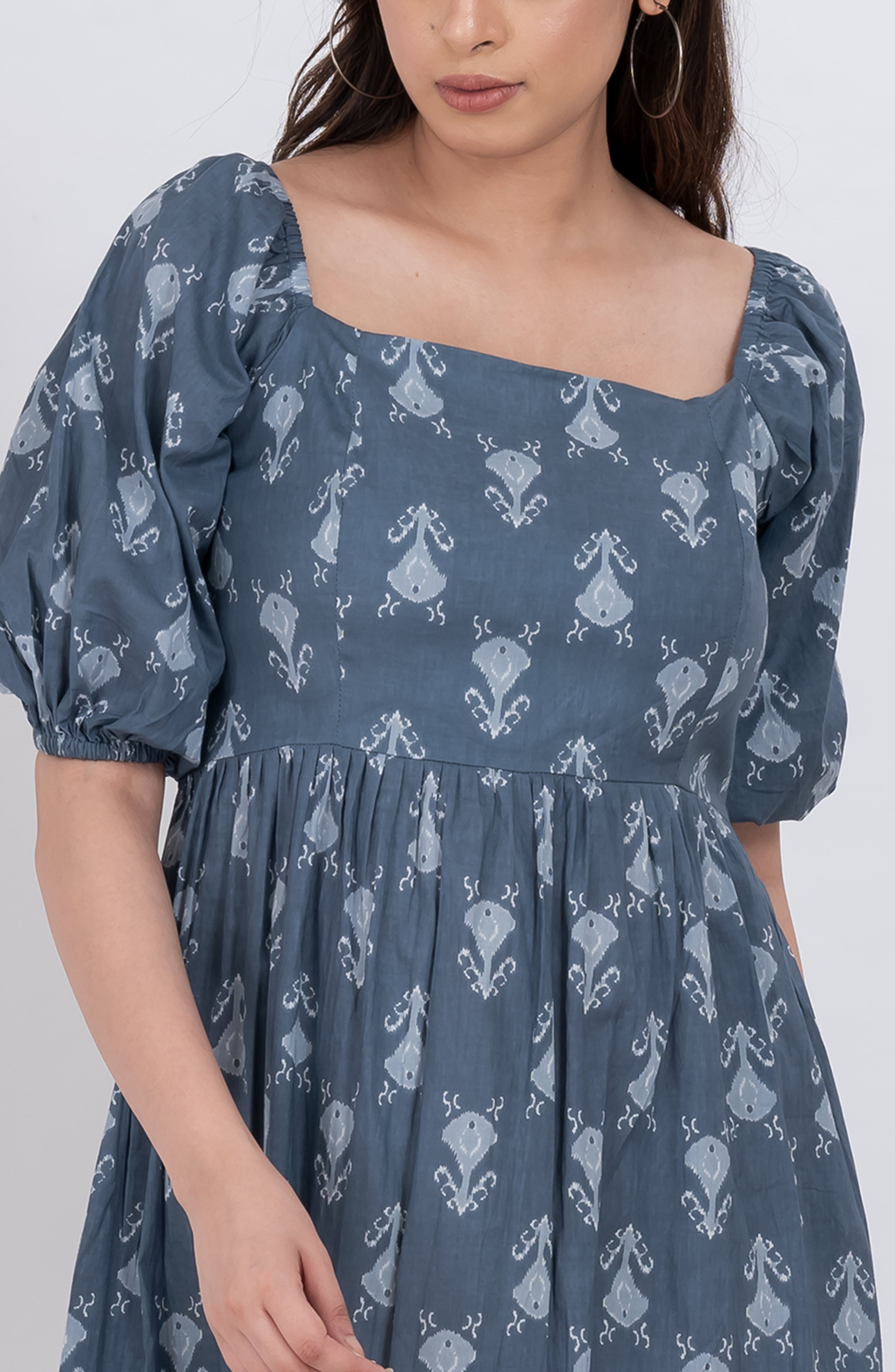 Flattering floral puff sleeve dress with square neck and flowy skirt
