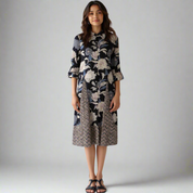 Full-length shot of the dress showcasing its summer-ready look with floral prints and chevron detail