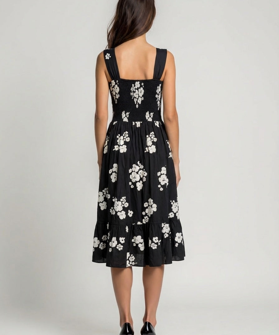 Black dress with white floral pattern wide strap floral flare