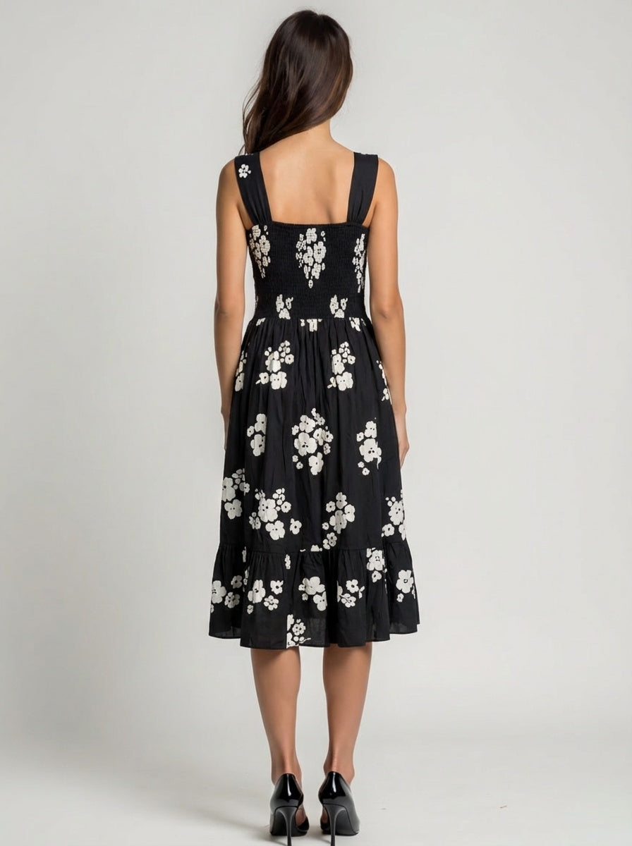 Black dress with white floral pattern wide strap floral flare