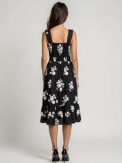 Black dress with white floral pattern wide strap floral flare