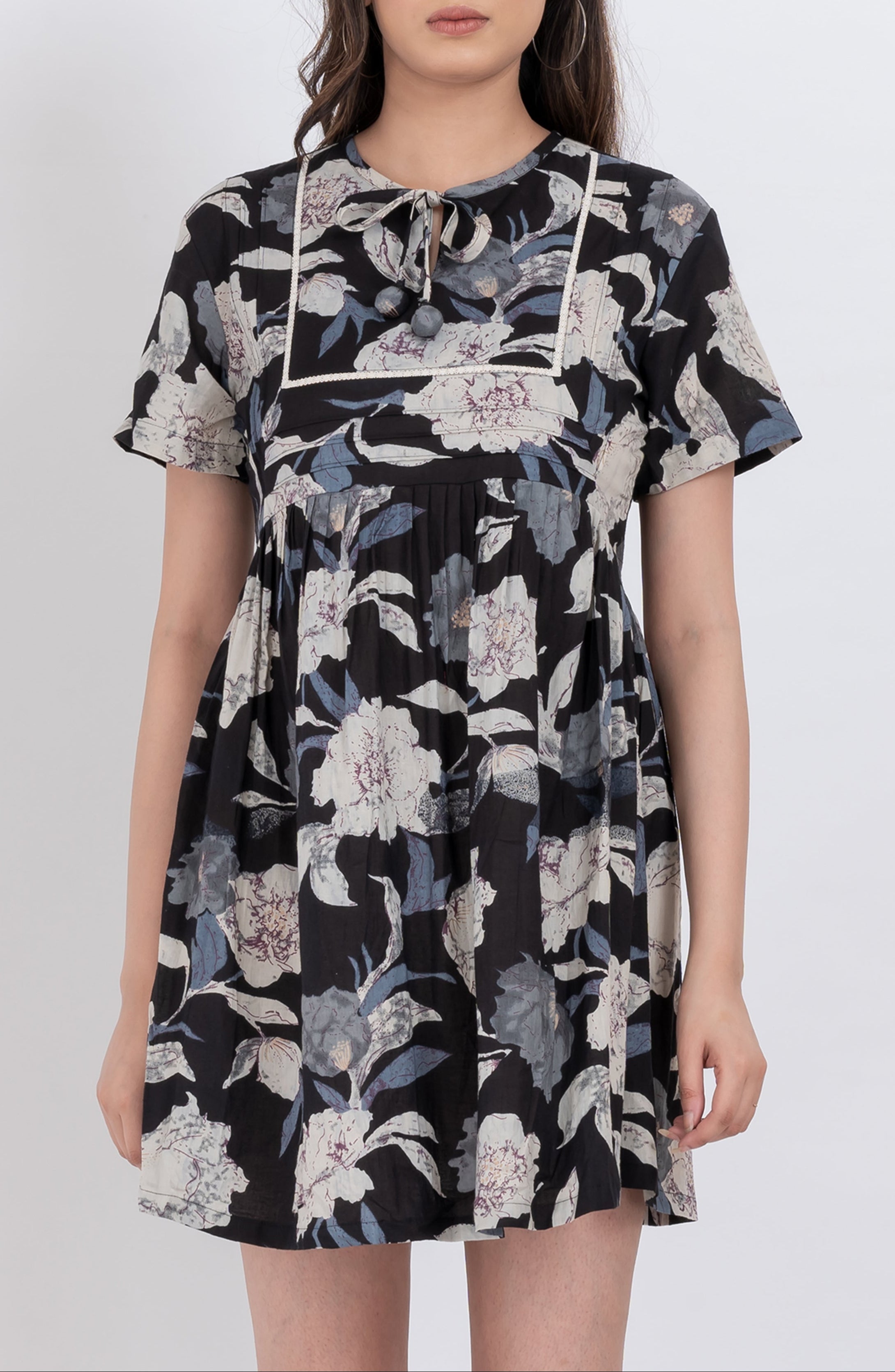 Trendy black floral babydoll dress with tie neck and short sleeves