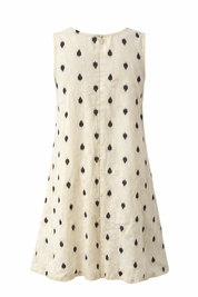 White sleeveless dress with black pattern on a white background