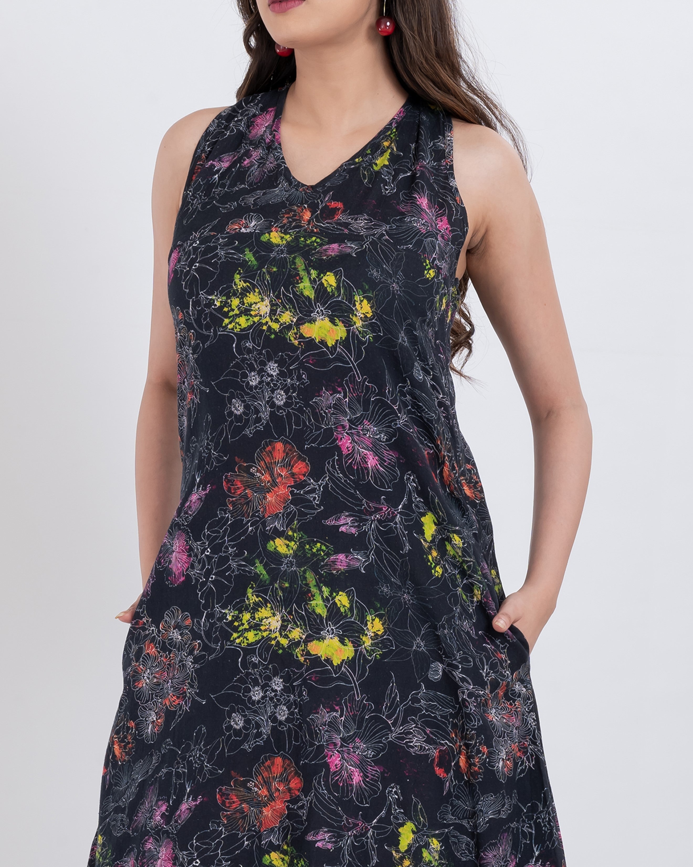 vibrant floral sleeveless maxi dress made with soft handloom cotton ideal for resort wear and summer evenings.
