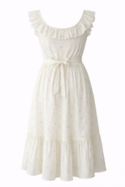 White dress with ruffled neckline on a white background