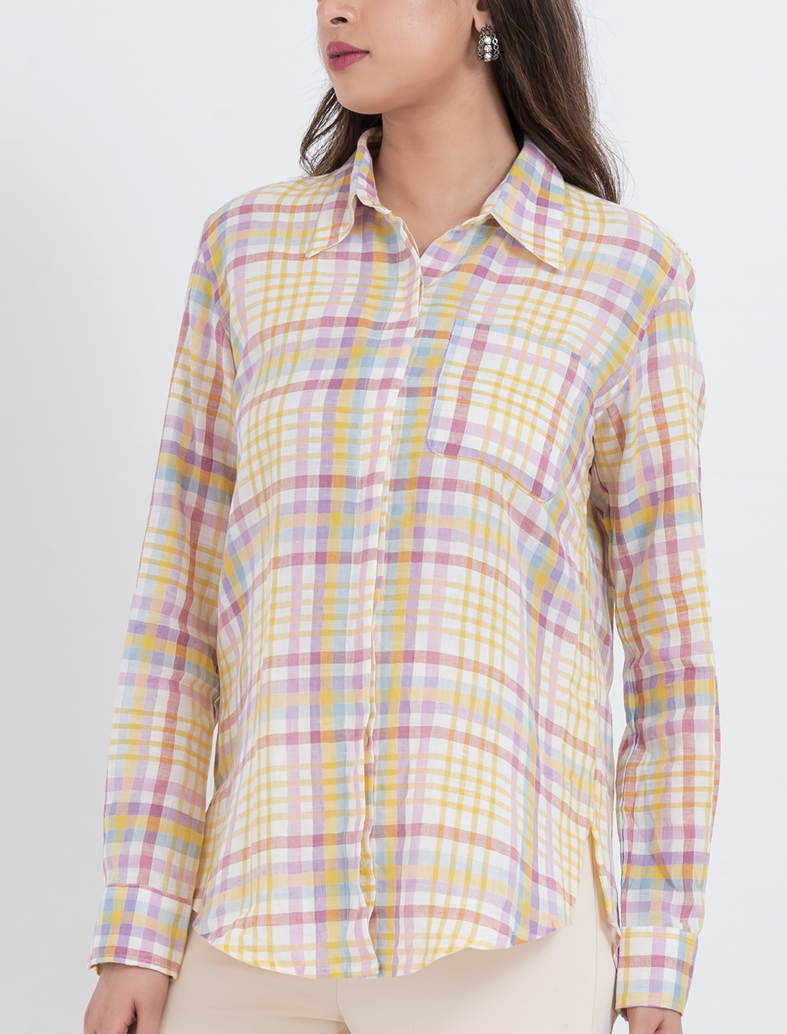 Pastel plaid blouse with a button-up front and long sleeves.